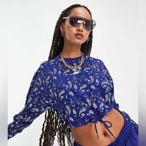 Puma Off Beat paisley print cropped sweatshirt in blue